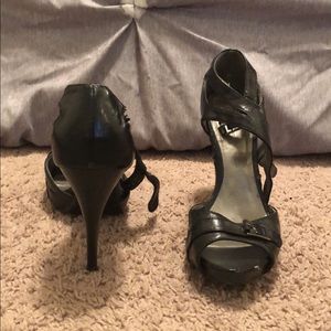 Black leather heels with buckle detail